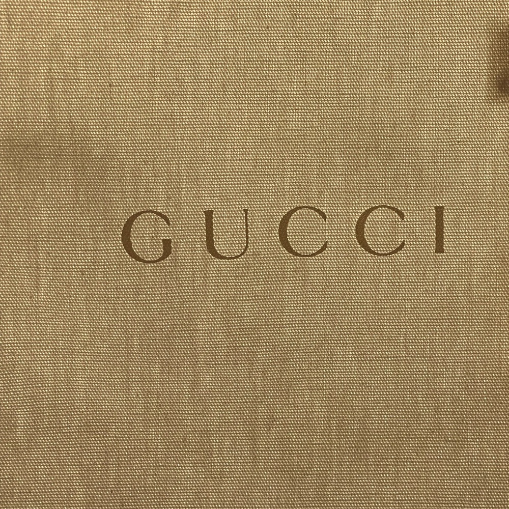 2 white Gucci shoe protectors 👠